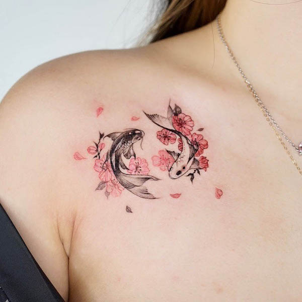 Double koi fish under the collarbone by @tattooer_manda