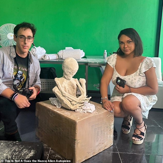 Above, two of Maussan's collaborators, documentary producers Serena DC (right) and Michael Mazzola (left), pose with a new 'alien' mummy from this March - which they said has 30 percent 'unknown' DNA