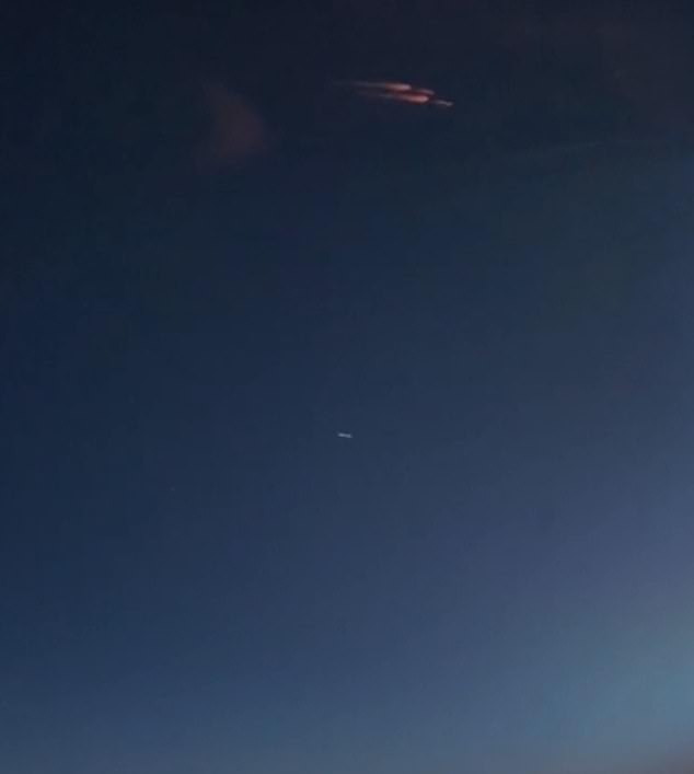 A stunning photograph taken by a Fedex pilot of a meteor burning up in the atmosphere, with a white blob below it resembling the objects captured by Vernet and the other witnesses he gathered