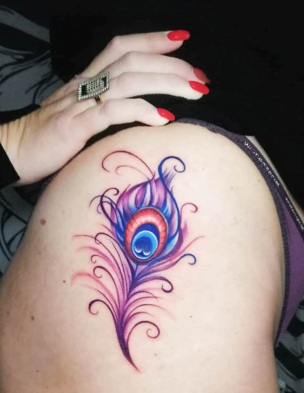 Vibrant peacock feather tattoo by @zulezutattoo