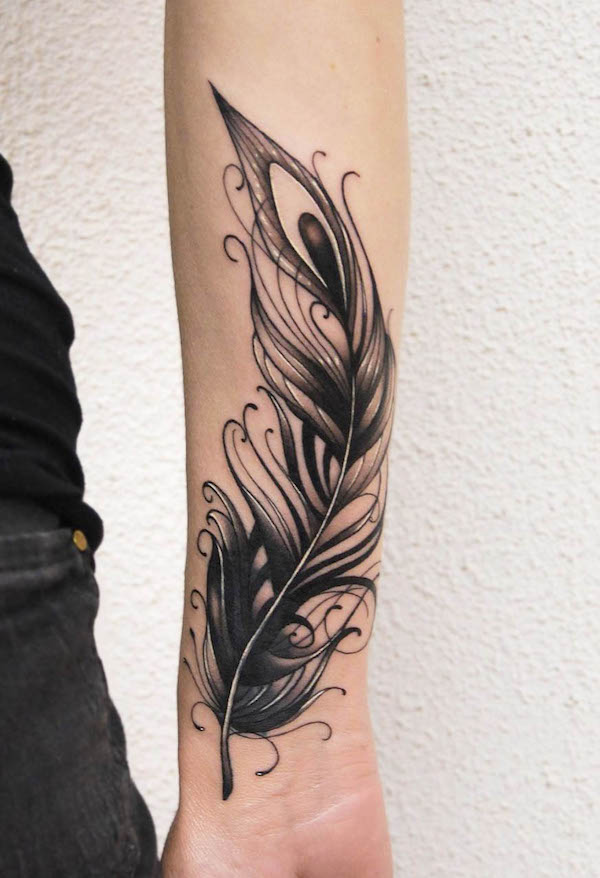Super bold blackwork feather tattoo by @greenydraws