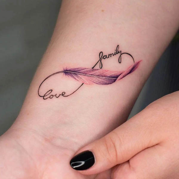 Meaningful infinity feather tattoo by @women.tattoo.tehran