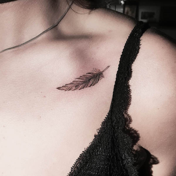 Small and simple feather collarbone tattoo by @joeydeboer