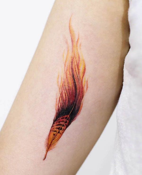 Phoenix feather tattoo by @tattoist_doy