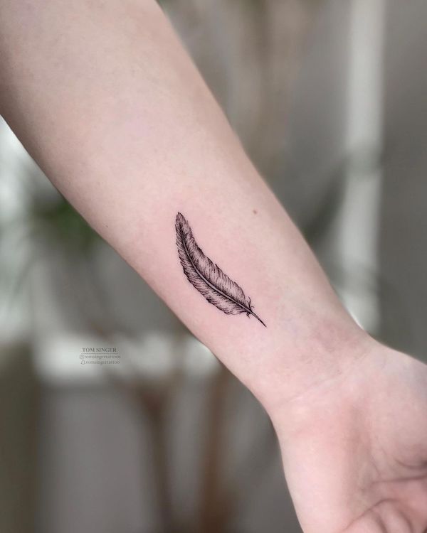 Simple feather wrist tattoo by @tomsingertattoos