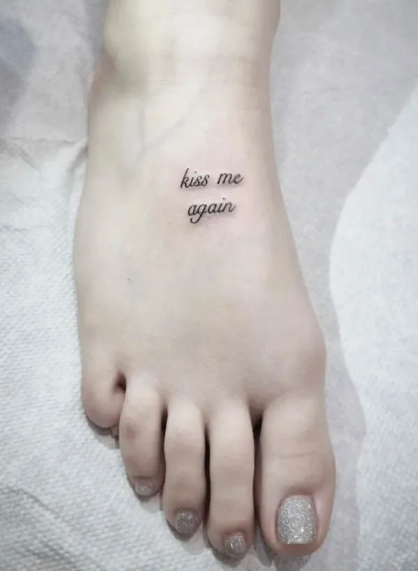 kiss me again quote foot tattoo by @buccaneertattoo