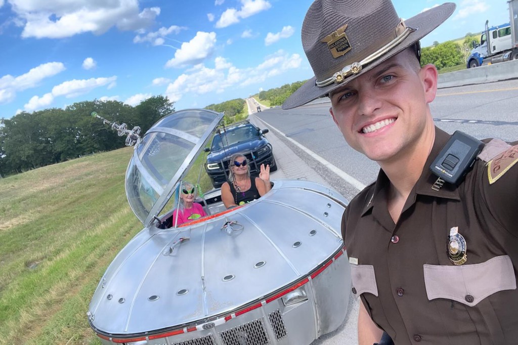 Oklahoma Trooper Ryan Vanvleck snapped a selfie with the odd-looking auto in the background. 