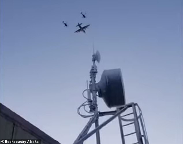 Military aircraft flying towards where the wreckage is believed to be in remote Alaska