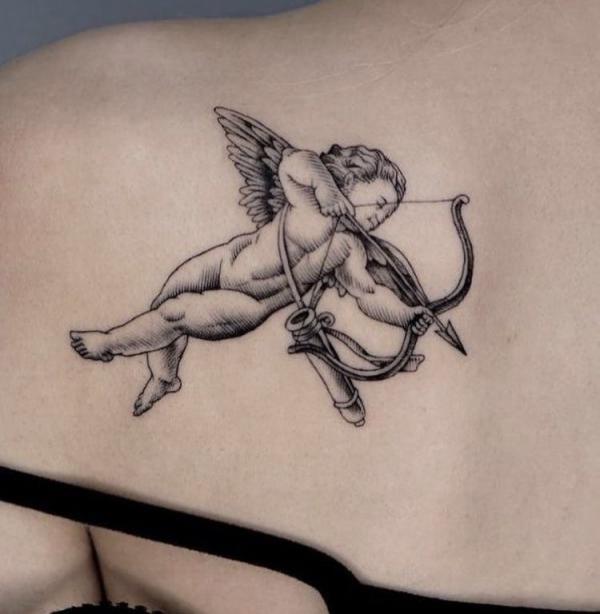 cupid shoulder blade tattoo