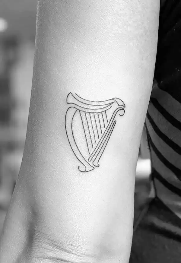 Harp tattoo by @stephen_doyle_tattoo