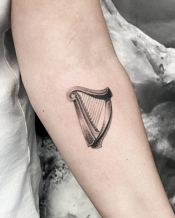 Harp tattoo by @danyadamtattoo