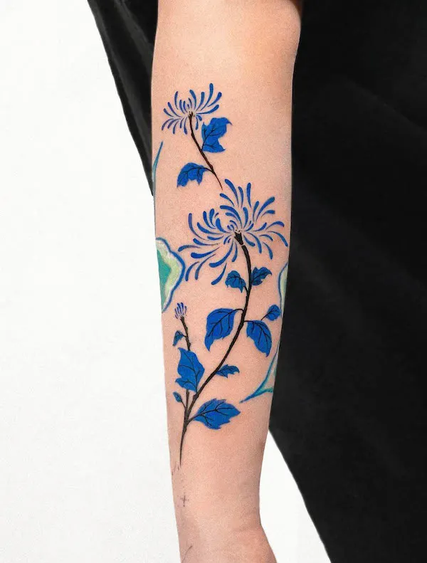 Abstract blue flowers forearm tattoo by @offtattooer