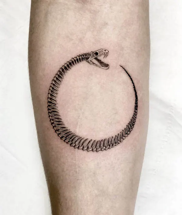 Skeleton ouroboros tattoo by @sana.ink