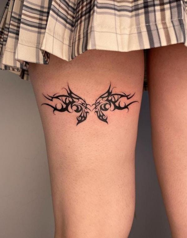 Butterfly cyber sigilism tattoo on the back of thigh