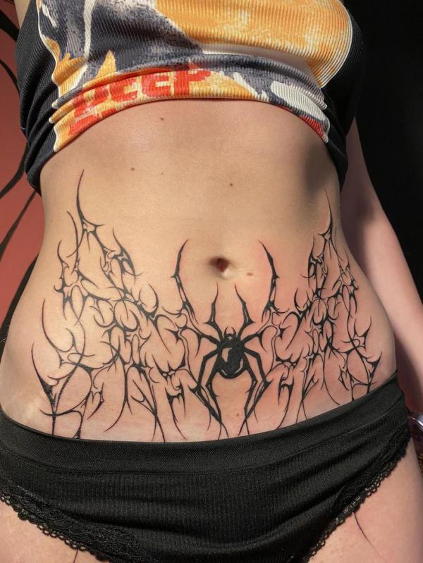 cyber sigilism with spider tattoo belly